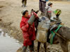 Boy loading water on Donkey